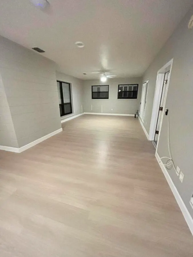 Great room after fresh paint and new plank flooring